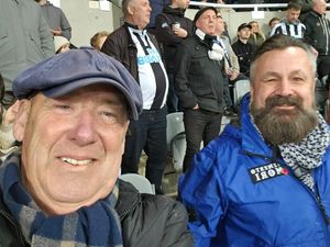 Terminally ill Newcastle United fan Steven Hunter (left) in the stands