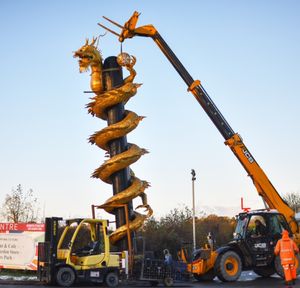 The sculpture being moved into place.