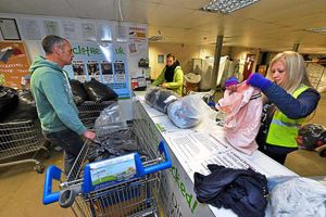 Staff at Cash4Clothes with customer Chris Haynes, from Cannock