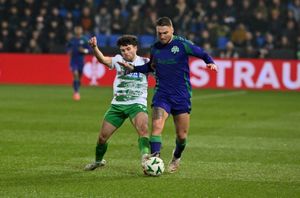 The New Saints midfielder Ben Clark and Panathinaikos Bart Schenkeveld