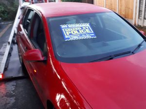 Police seized a red car that failed to stop for officers and was found abandoned nearby 