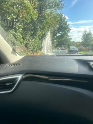 Water spurting from the burst water main on Ellesmere Road. Photo: Charlotte Hayley