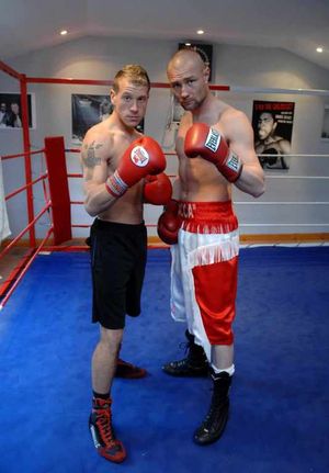 Darren McDermott (right) and Jason Welborn during their sparring days at his home gym.