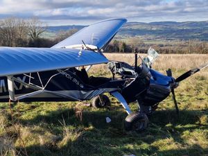 The pilot was airlifted to hospital after crash-landing in a field.
