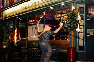 Fire eater outside Loopy Shrew