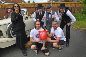 WALSALL COPYRIGHT NATIONAL WORLD TIM STURGESS 10/05/25. Harry Matthews memorial/ fundraising day Teenager Cancer TrustFootball themed with signed Wolves ball at the Milestone pub , New Invention, Willenhall. Organisers , left, Ben Colliver and Ryan Perrins with the Peaky Blinders.