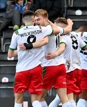 George Miller celebrates his goal