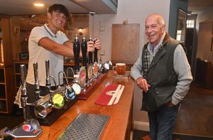 Jacob Sharps serves Chris Heathcote from one of the four hand pull ales