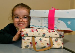 Harlow Berrington with some of the shoeboxes collected at Westacre Infants School for the Samaritan's appeal