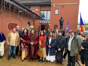 Members of the congregation with Maha Putri at Wat Phra Maha Somboon Buddha Vihara, Wolverhampton. 