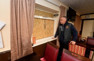 Iain Marsh with one of the damaged windows