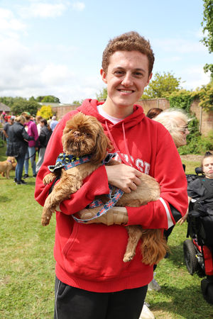 Student at Derwen College, George, with his dog.