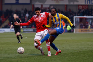 Nathanael Ogbeta of Shrewsbury Town and Travis Johnson of Crewe Alexandra.