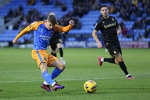 George Lloyd of Shrewsbury Town scores a goal to make it 3-1