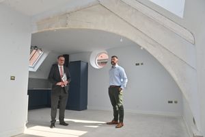 Liam Floyd shows Mark Andrews the impressive roof beams of the upper courtroom