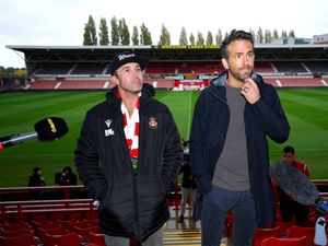 Supporting image for story: Ryan Reynolds and Rob McElhenney mark Wrexham visit with gin shots