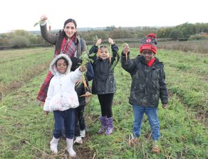 Hunting for carrots Graiseley pupils with Year 1 teacher Mandeep Sandhu