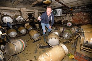 Ollie Parry, owner of The Salopian bar, Shrewsbury, surveys the cellar of the pub after the extensive flooding