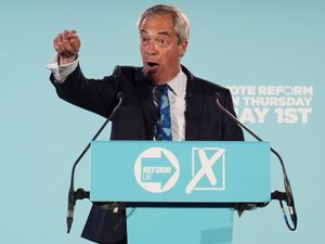 Nigel Farage gives a speech at a Reform UK press conference