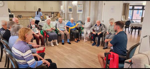 Residents at HC-One’s Lime Trees Care Home getting involved in armchair exercise session