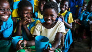 Children in Malawi enjoying a school meal from Mary's Meals. Photo: Mary's Meals
