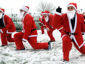 Supporting image for story: Santas out in force for charity dash