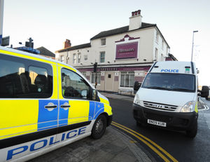 Police outside The Strollers pub, from where landlady Katherine Picken rushed to Mr Campbell's aid