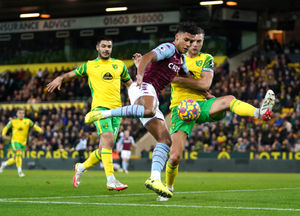 Aston Villa's Ollie Watkins and Norwich City's Ben Gibson (right) 