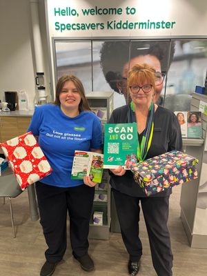 members of the team at Specsavers Kidderminster gather up the latest shoebox donations.