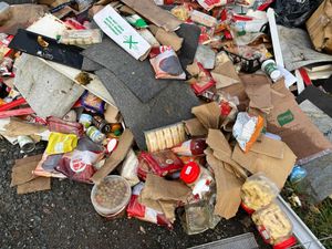 Shropshire Council said it was investigating after a large pile of rubbish - including food waste, cardboard and a shopping trolley - was dumped in a layby near Shifnal