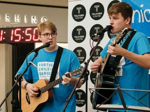 Supporting image for story: Duo’s marathon busk raises £1,200 - with video