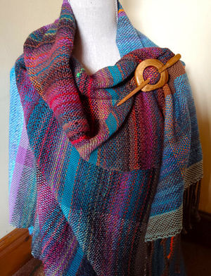 A hand woven shawl by Sue Wright of Woollen Tree will be on display