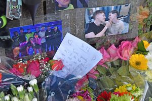 Floral tributes and pictures have been left at the scene