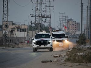 Supporting image for story: Palestinian militants hand over the remains of two more hostages