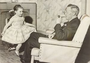 A special sub-committee set up by Wednesbury Council had chosen Diane of Crewe Road Primary School, to present a bouquet to Her Majesty the Queen during her visit. The photograph shows Diane practising her curtsey in front of her grandfather, Mayor Councillor L. V. Waldron, in May 1962.
