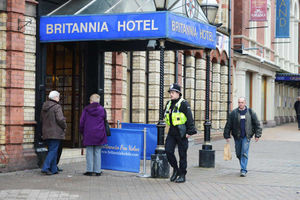 A police officer at the scene of the murder.