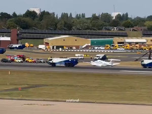 Supporting image for story: Watch: Scenes of rescue as Birmingham Airport holds flights for several hours following 'emergency landing'