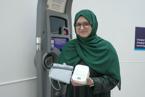 Councillor Obaida Ahmed, the City of Wolverhampton Council's Cabinet Member for Health, Wellbeing and Community, with the two types of blood pressure monitoring machines available from WV Active Bilston-Bert Williams and other community locations.
