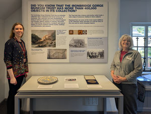 Kyla Hislop and Kate Cadman from the Collections team with the new Tollhouse display