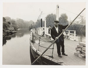 Bert the Boatman, Arley Ferry, River Severn. Bert Evans operated the ferry across the river, but the building of a footbridge was due to make him redundant. The photograph shows Bert pushing off the boat, with a crane erecting the footbridge in the background. Pictures on October 5, 1971.