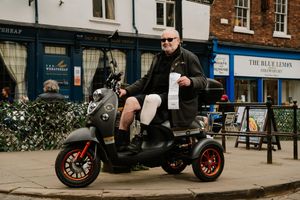Alan Briscoe on his scooter