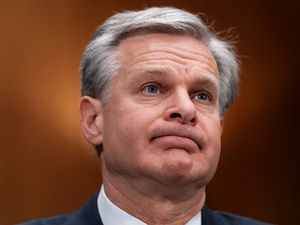 Supporting image for story: FBI director says he intends to resign at end of Joe Biden’s term