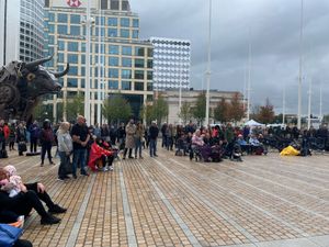 People watch the funeral of Queen Elizabeth II on a big screen in Centenary Square, Birmingham. Photo: Richard Vernalls/PA Wire