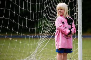 Six-year-old Hattie Stokes defends goal 