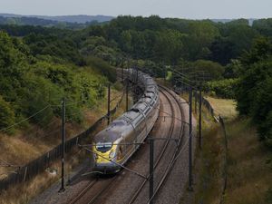 A Eurostar train travels through Ashford in Kent