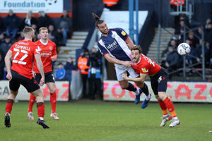 Andy Carroll of West Bromwich Albion and Tom Lockyer of Luton Town during the Sky Bet Championship match between Luton Town and West Bromwich Albion at Kenilworth Road on February 19, 2022 in Luton, England. (Photo by Adam Fradgley/West Bromwich Albion FC via Getty Images).