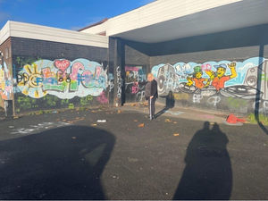 Councillor Tina Jukes surveys the graffiti daubed on the Beechdale mural