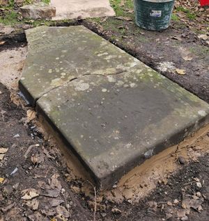 The stone being put back in place.