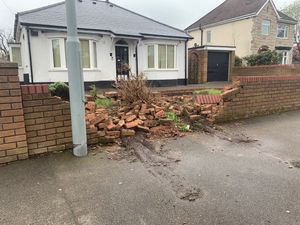 The damaged wall following the crash on Primrose Lane