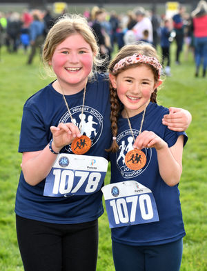 Millie Barnard, and her sister Rosa, who took part in the Shropshire Primary Schools Half Marathon.